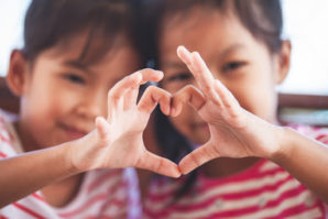 Many individuals and businesses donate cash, goods, and services to those organizations with a shared passion. A gift acceptance policy is a great way to gracefully manage your donors’ expectations. Two young children making a heart with their hands.