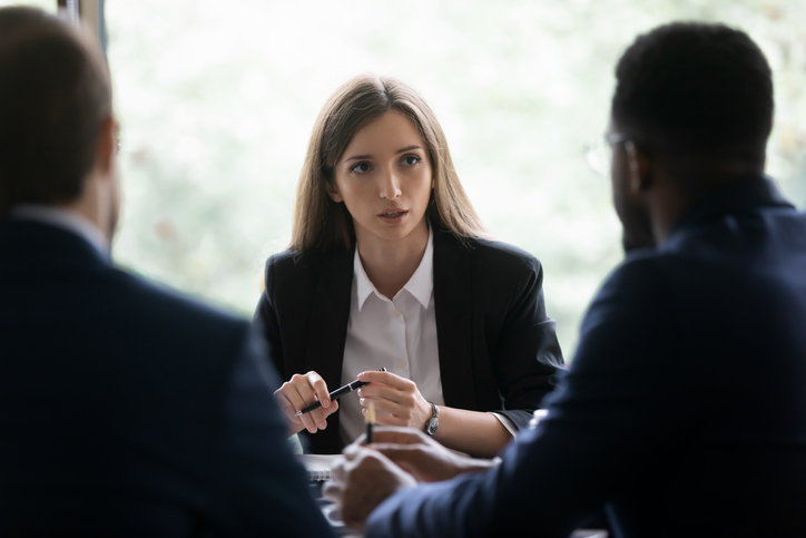 A banker and her clients engaged in a serious conversation. Here are three things that credit unions can consider as they manage interest rate risk and strive to find success in the face of volatility.