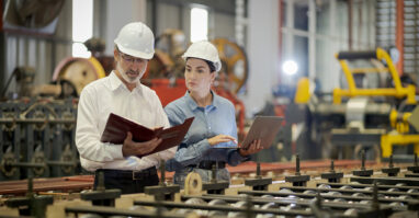 Two supervisors in a factory.web