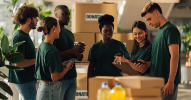 Charity workers sorting donations.web